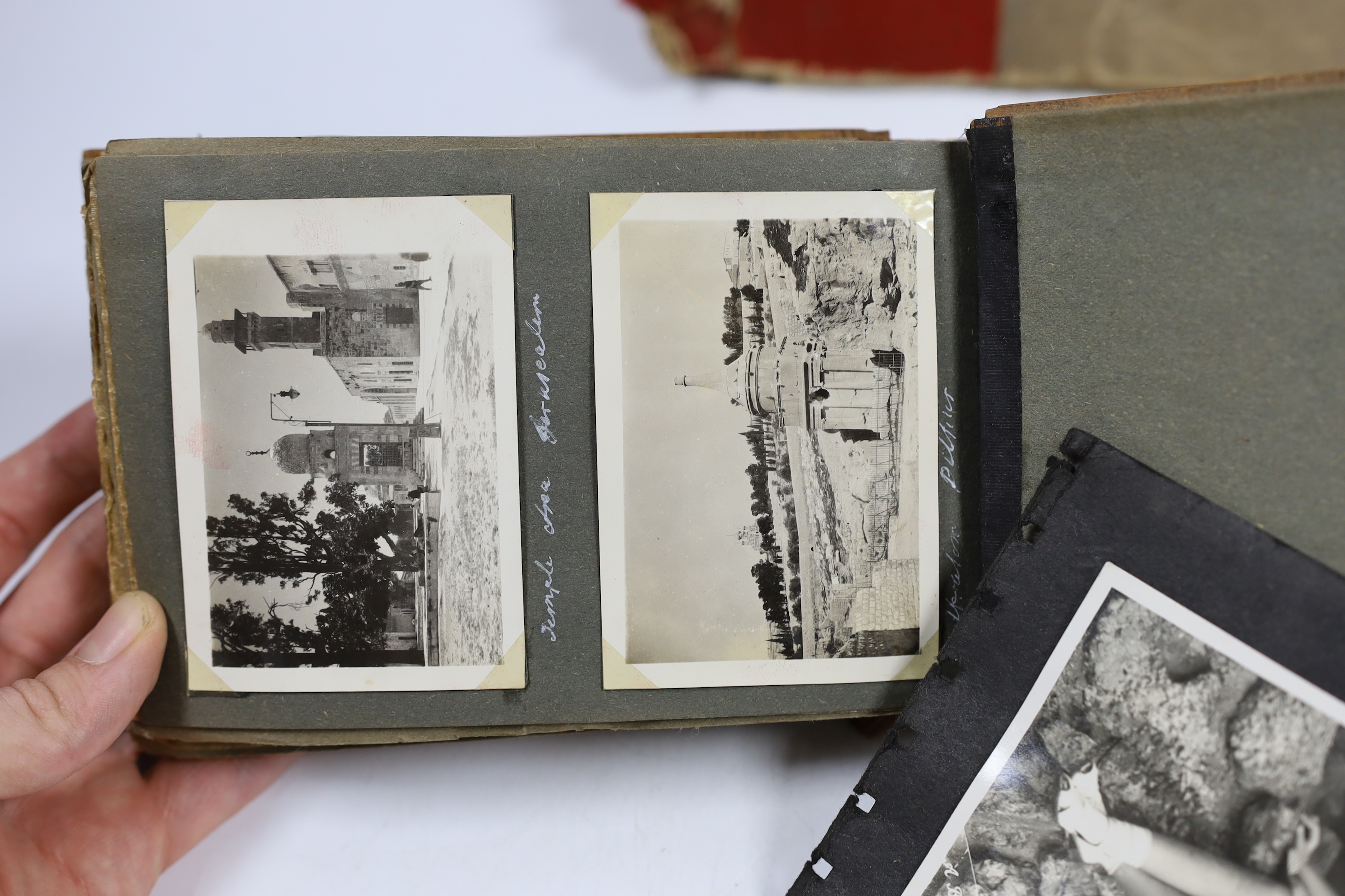 Two photographs albums; an album of early 20th century Middle Eastern travel photographs, together with a 1940s album of mainly naval photographs including war ships and aircraft carriers, some with descriptions on the r